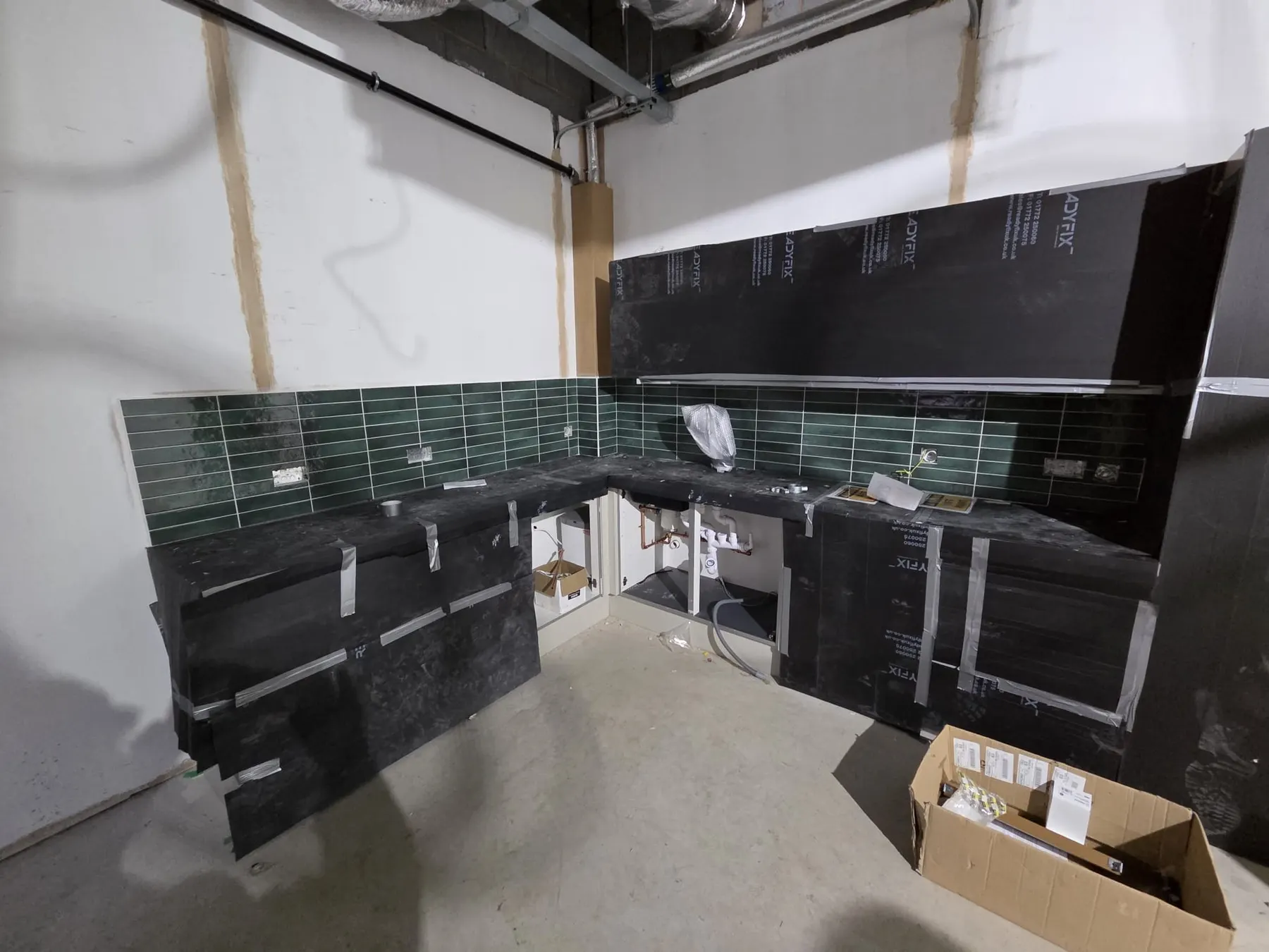 Staff kitchen splashback and floor during fit-out