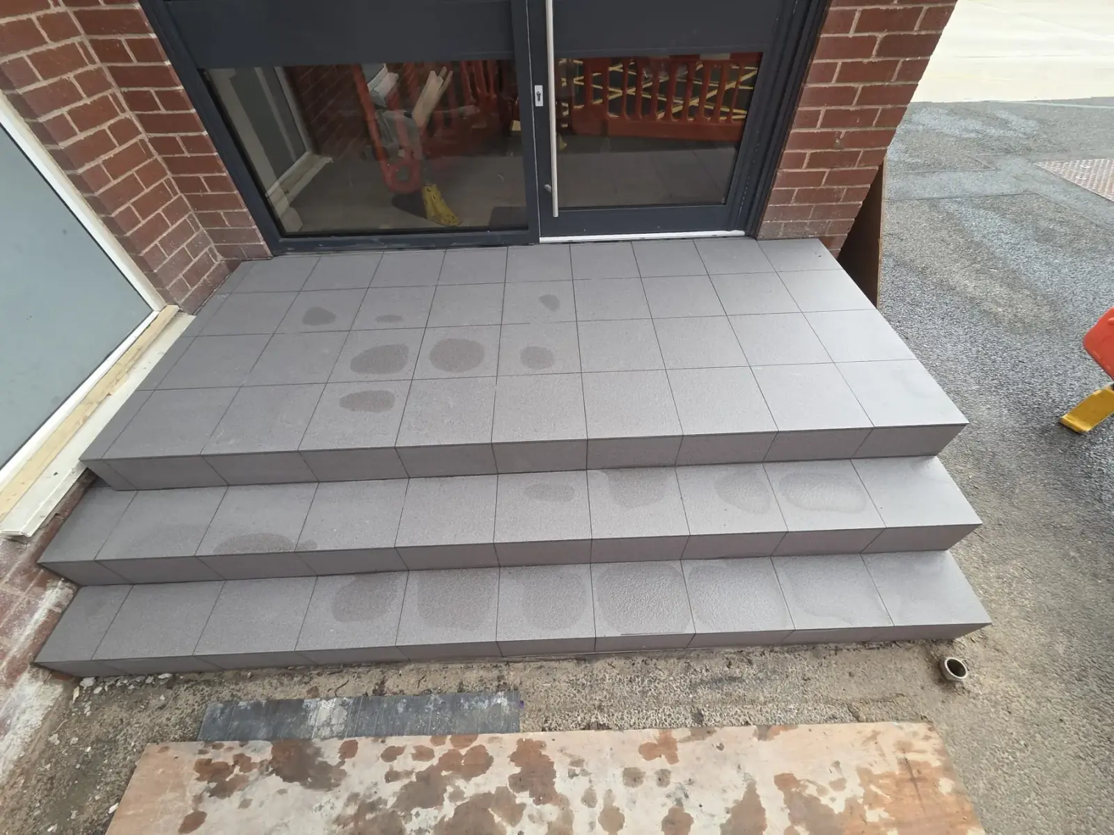Grey porcelain tiled steps at an entrance, BAE Systems Wharton