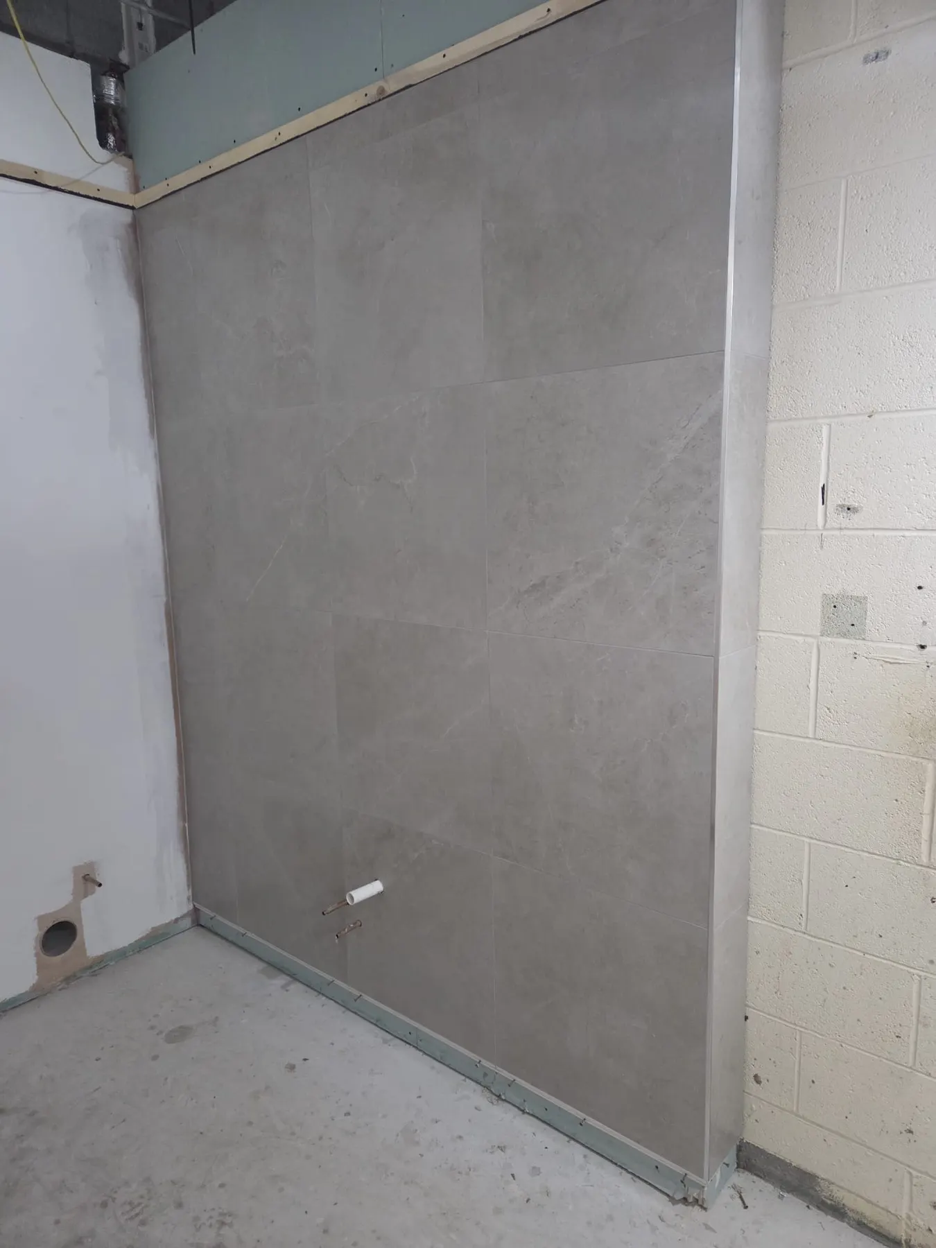 Large-format grey porcelain wall panel