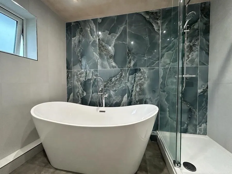 The feature wall running into the shower enclosure