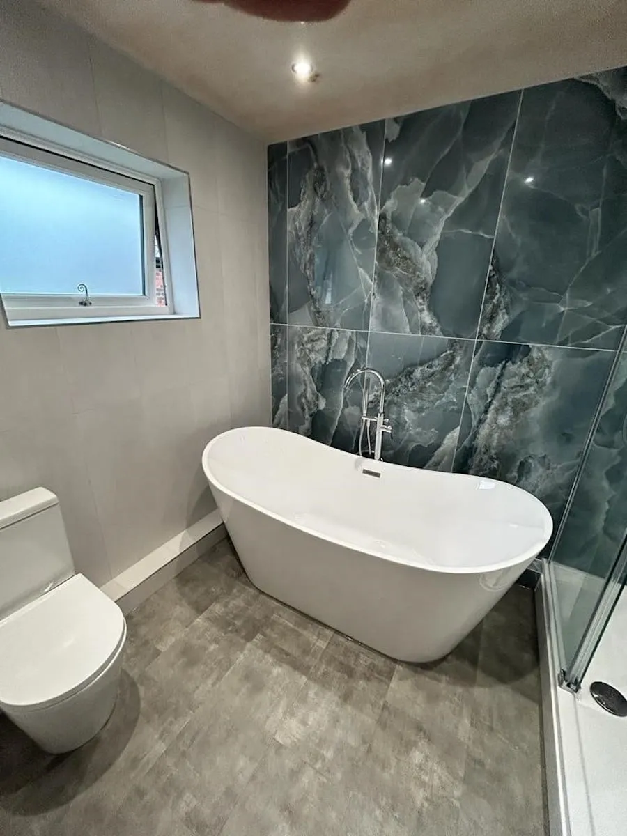 Light grey portrait wall tiles beside the feature wall
