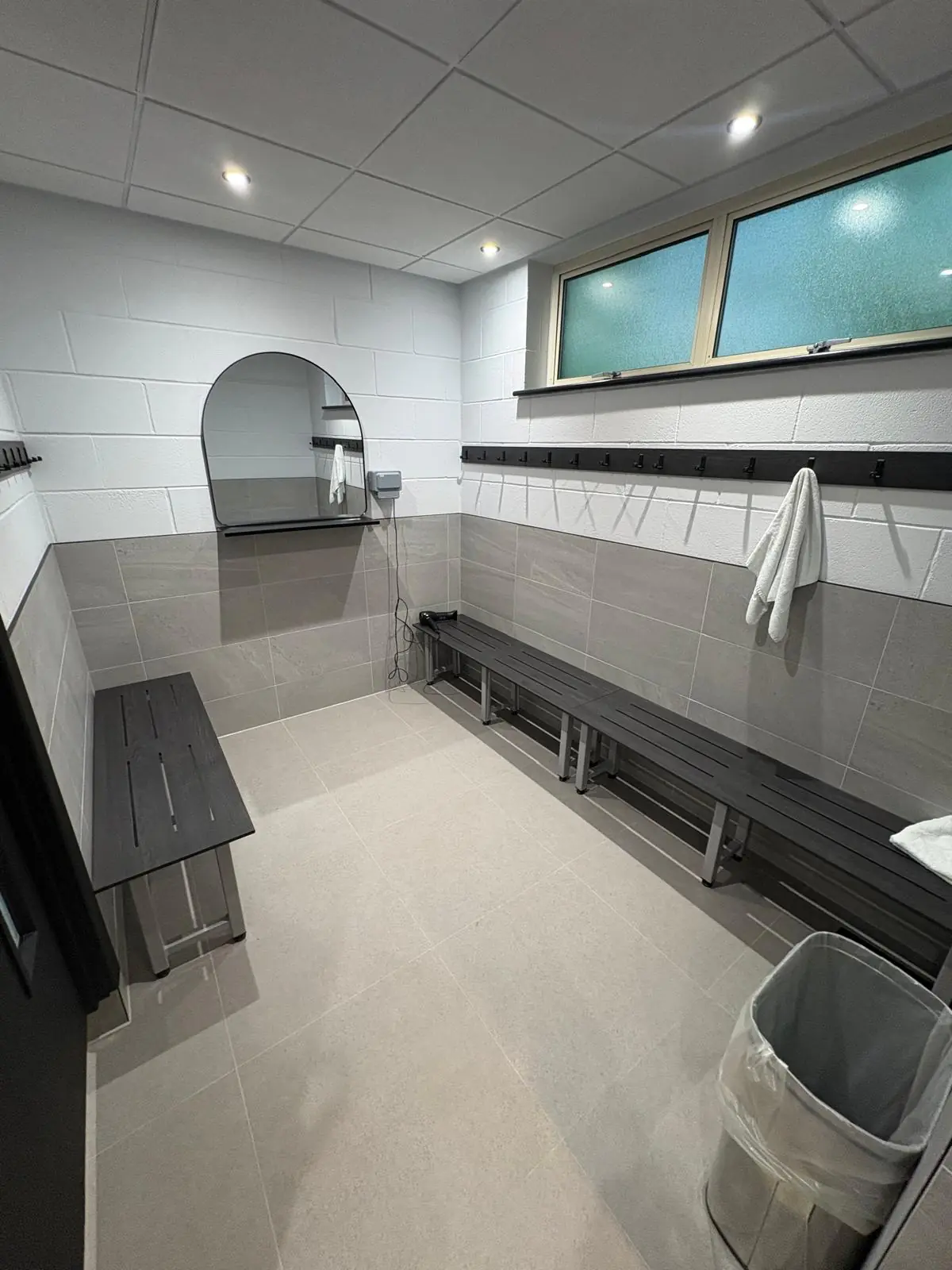 Staff changing room at Eric Wright’s head office in Bamber Bridge, with Soft Spartia Perla wall tiles and EXT Core Grey anti-slip floor tiles