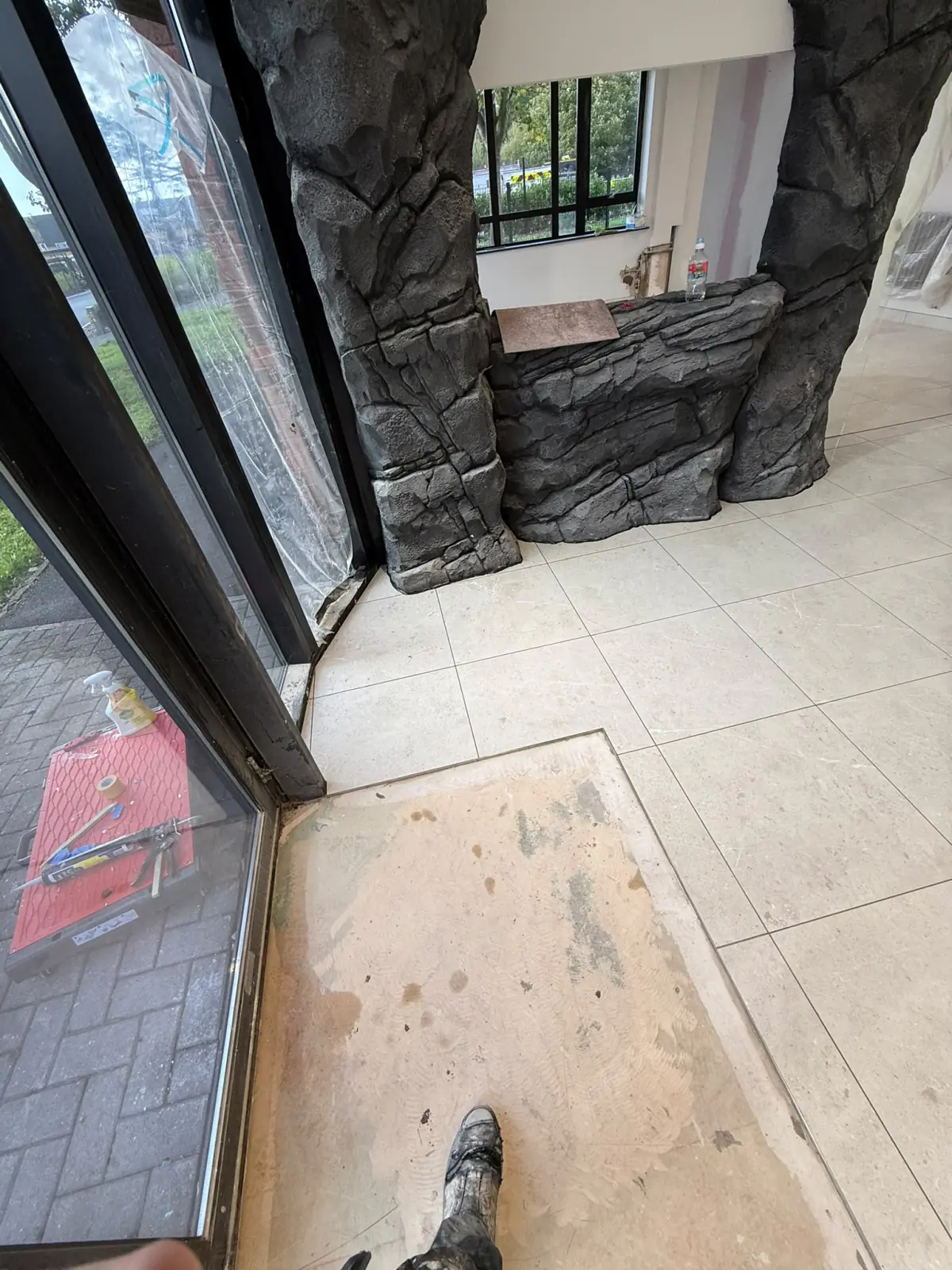 Tiling finished around the entrance matwell by the glazed doors