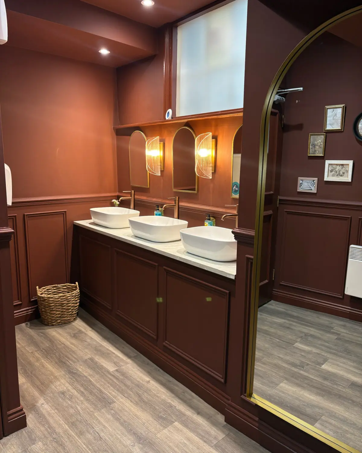 Ladies toilets with three vessel basins and a Harbour Oak LVT floor