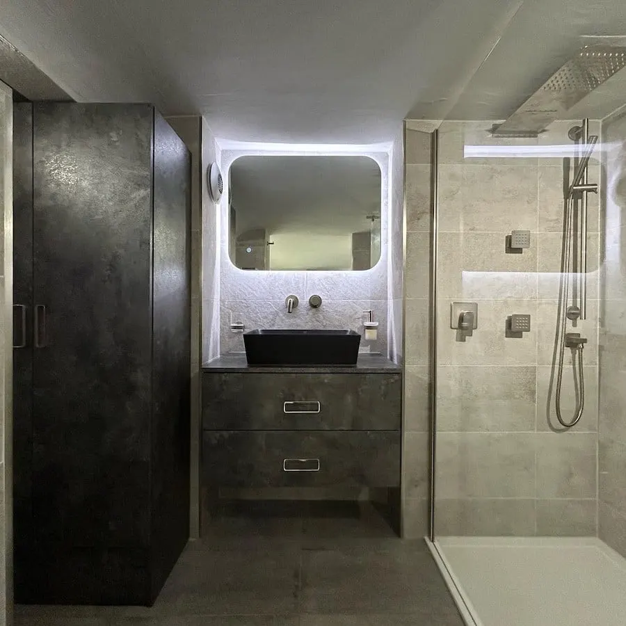 Vanity between dark and light walls