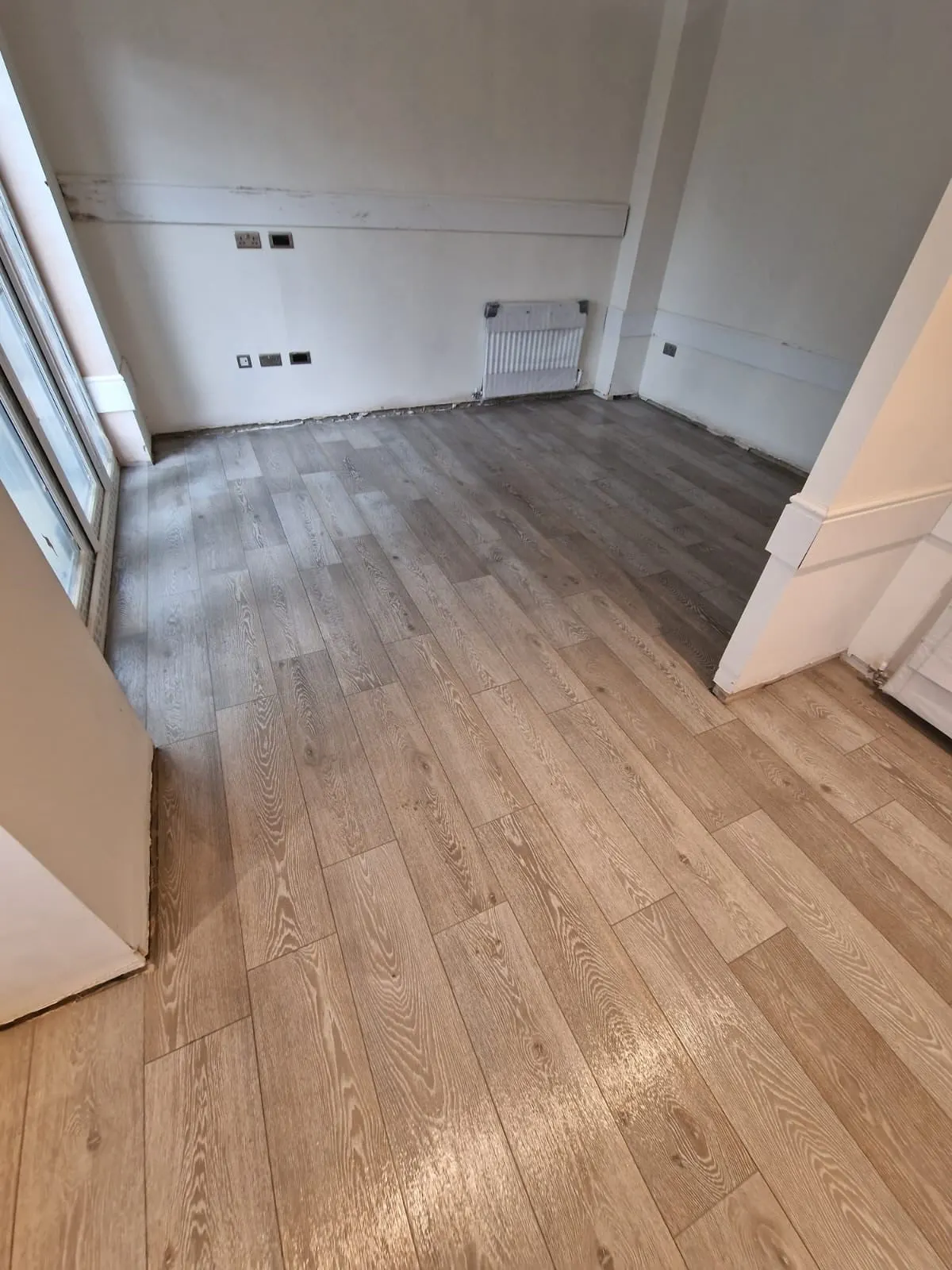 Wood-effect plank floor tiles in a reception room, Worden Gardens, Leyland