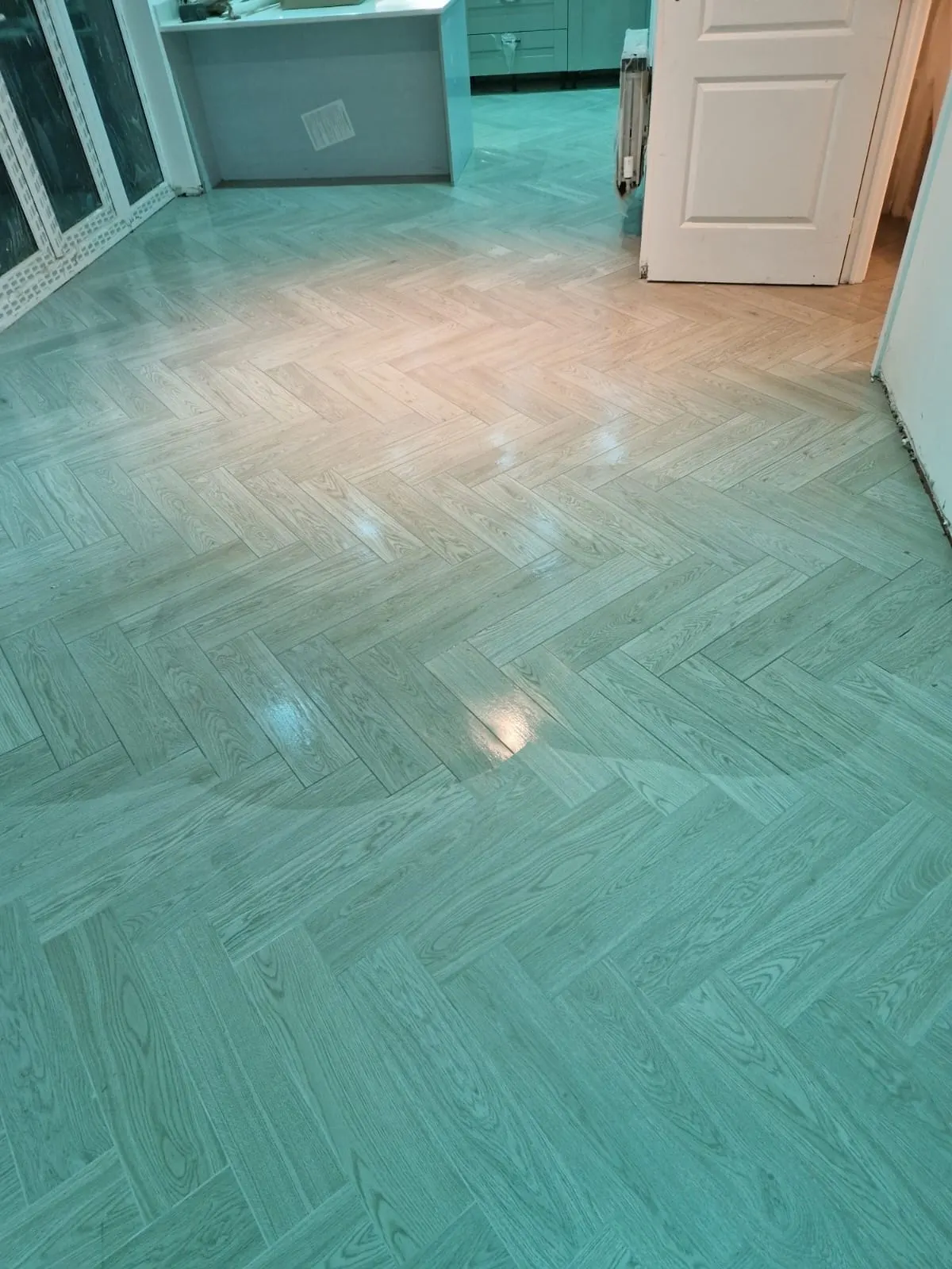 Porcelanosa Atlanta Grey herringbone floor on Redrow’s Foxglove development