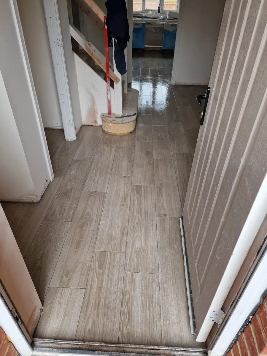 Wood-effect floor tiles in a new-build hallway, Sycamore Manor plot 53