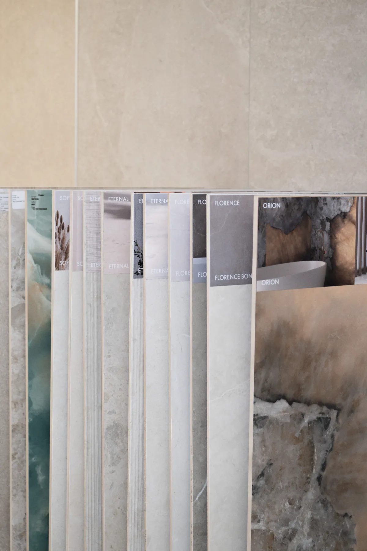 Rack of stone-effect tile samples in the Homematas showroom