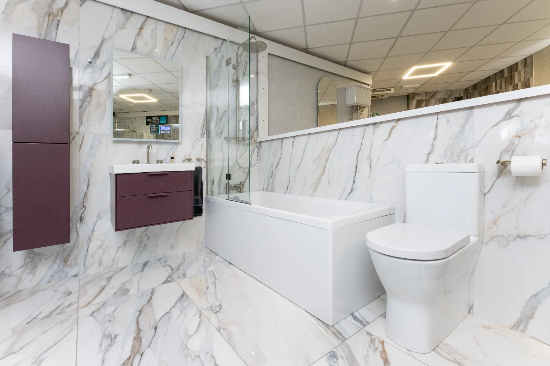 White marble-effect large-format tiles in a bathroom setting