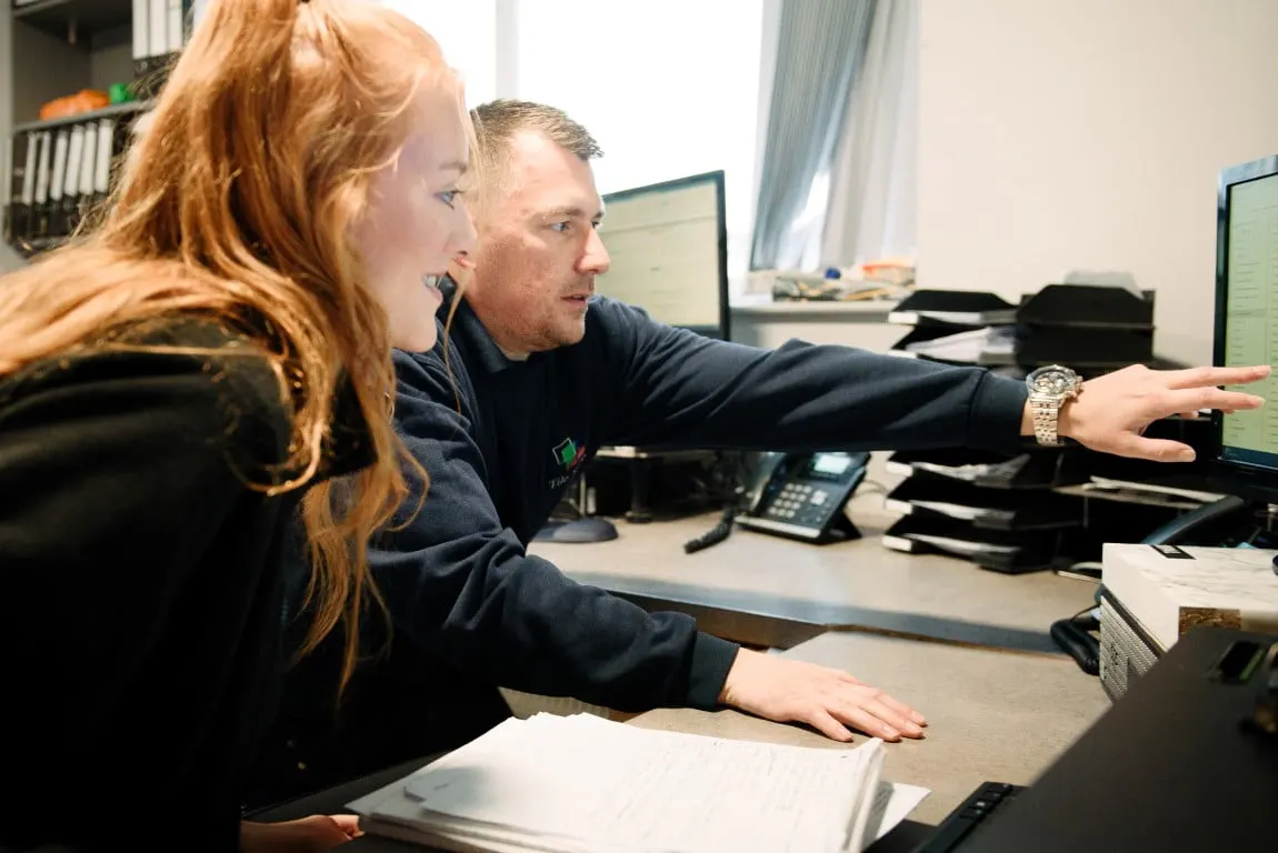 Two members of the Tile Style team planning a project on screen